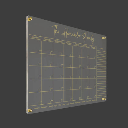 3D render of the personalized horizontal family acrylic calendar with gold standoff hardware on a dark background