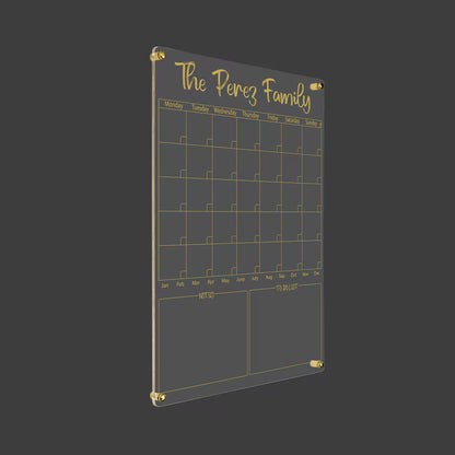 3D render of the personalized family acrylic monthly calendar with gold standoff hardware on a dark background