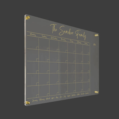 3D render of 'The Sanchez Family' acrylic monthly calendar with gold standoff hardware on a dark background
