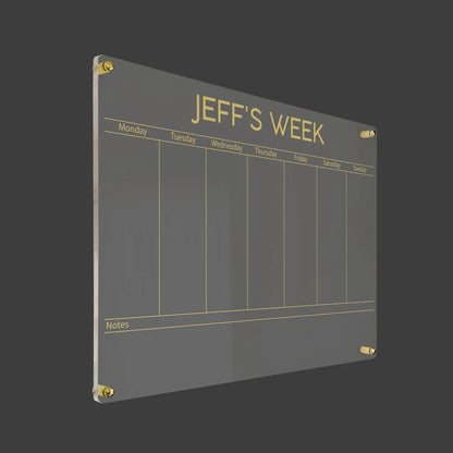 3D render of the personalized bold-title acrylic weekly planner with gold standoff hardware on a dark background