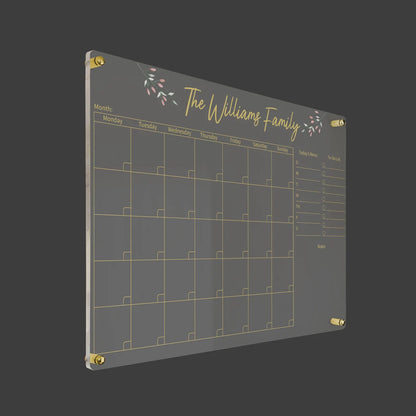 3D render of the floral personalized family acrylic calendar with gold standoff hardware on a dark background
