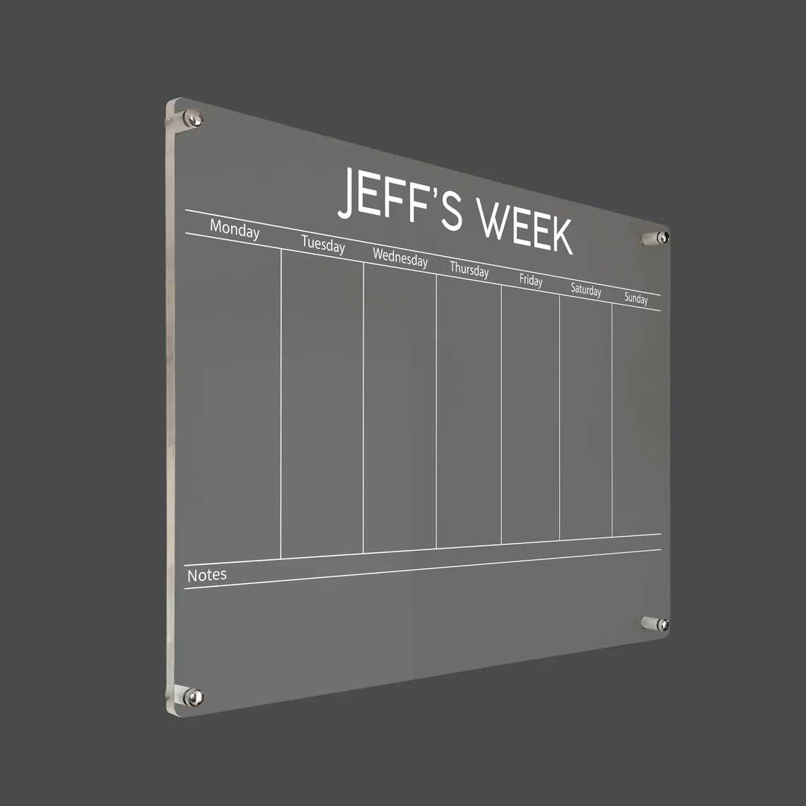 3D render of the personalized bold-title acrylic weekly planner with silver standoff hardware on a dark background