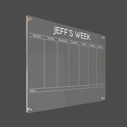 3D render of the personalized bold-title acrylic weekly planner with silver standoff hardware on a dark background
