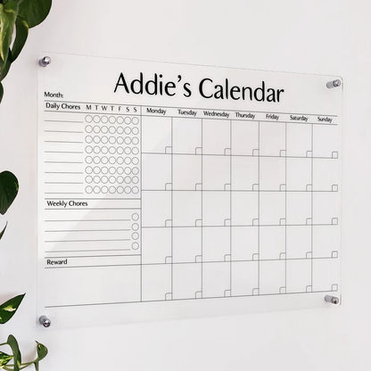 Personalized clear acrylic 'Addie's Calendar' chore chart with daily/weekly chore trackers and monthly grid