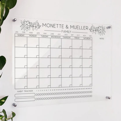 Personalized clear acrylic 'Monette & Mueller Family' calendar with floral illustrations and a habit tracker