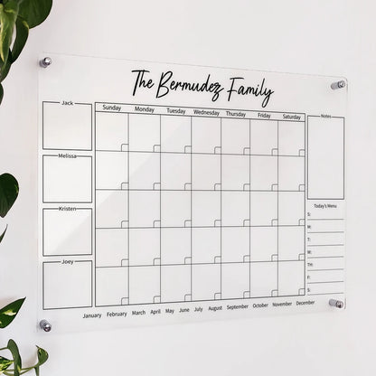 Personalized clear acrylic 'The Bermudez Family' calendar with 4 named boxes, monthly grid, notes, and menu