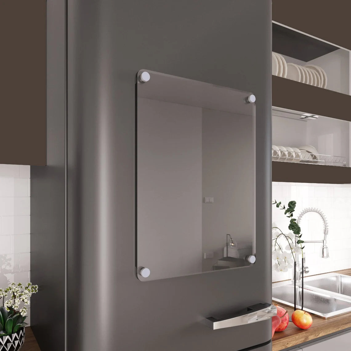 Blank clear acrylic magnetic calendar mounted on a stainless steel refrigerator door in a modern kitchen