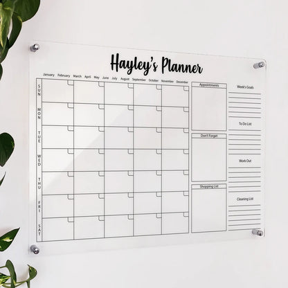 Personalized clear acrylic 'Hayley's Planner' with monthly grid, appointments, shopping list, and weekly goals
