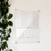 Personalized clear acrylic chore chart for 'Joanna' and 'Jackson' with weekday checkboxes, weekly grid, and notes
