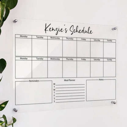 Personalized clear acrylic 'Kenzie's Schedule' board with two weekly grids, reminders, and meal planner sections