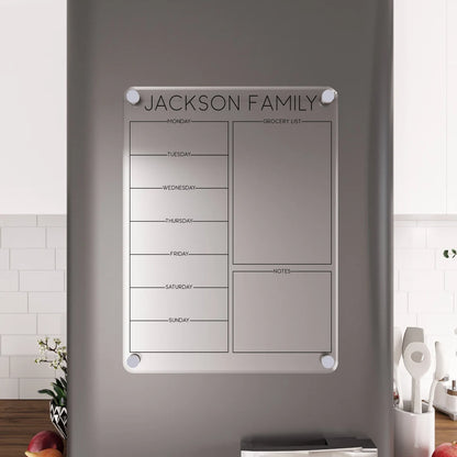 Personalized acrylic 'Jackson Family' magnetic fridge planner with grocery list, close standoff hardware view