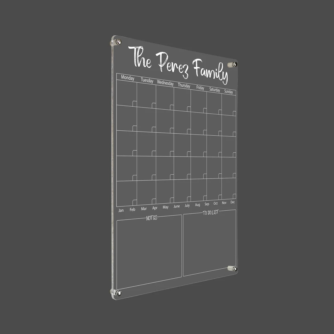3D render of the personalized family acrylic calendar with silver standoff hardware on a dark background