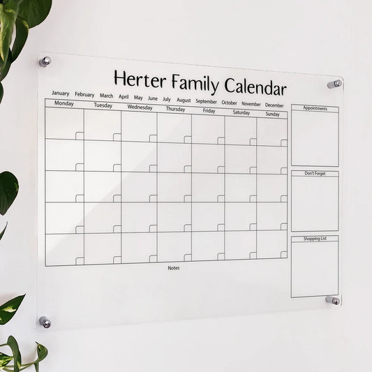 Personalized clear acrylic 'Herter Family Calendar' with appointments, don't forget, and shopping list sections