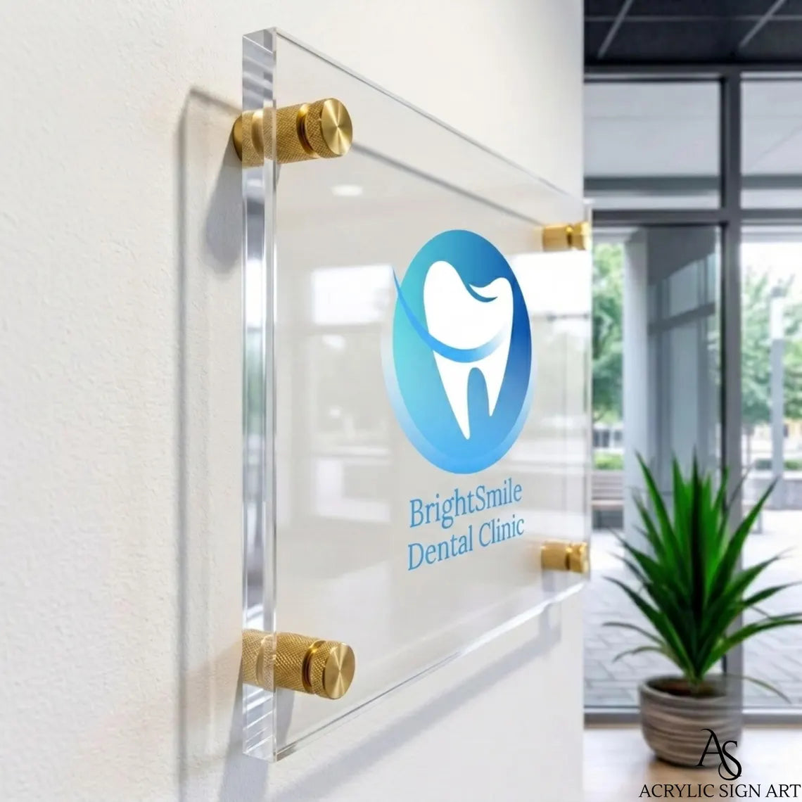 Side profile of the thick clear acrylic dental clinic sign showing edge depth and gold standoffs